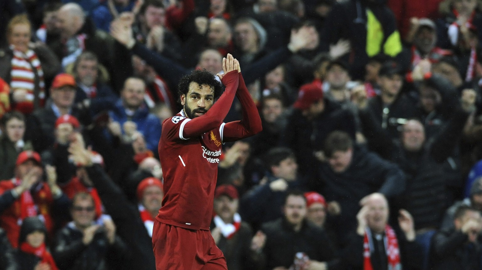 Liverpool&#039;s Mohamed Salah celebrates after scoring his side&#039;s opening goal during the Champions League semifinal, first leg, soccer match between Liverpool and Roma at Anfield Stadium, Liver ...
