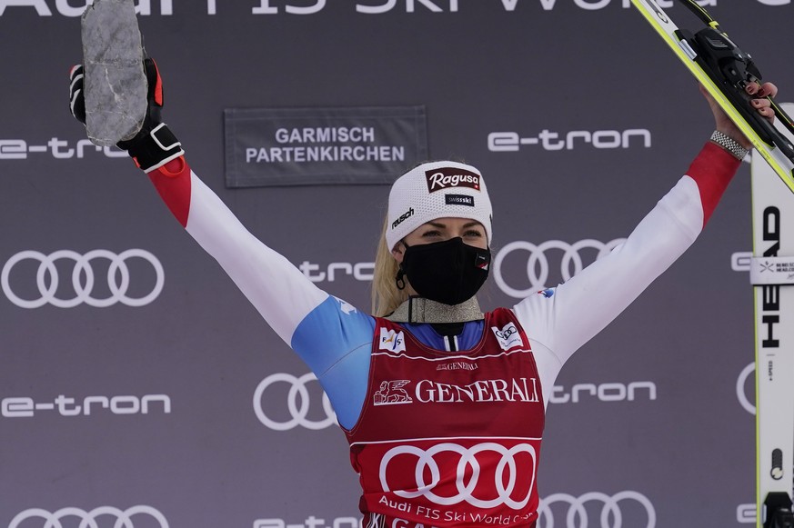 The winner, Switzerland&#039;s Lara Gut-Behrami celebrates on podium after completing an alpine ski, women&#039;s World Cup super-G race in Garmisch-Partenkirchen, Germany, Saturday, Jan. 30, 2021. (A ...