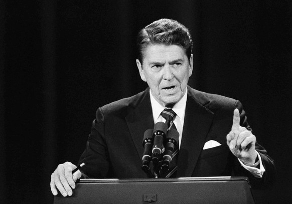 President Ronald Reagan poses while asking and answering questions during a debate with Democratic challenger Walter Mondale, Sunday, Oct. 8, 1984, Louisville, Kentucky. (AP Photo)