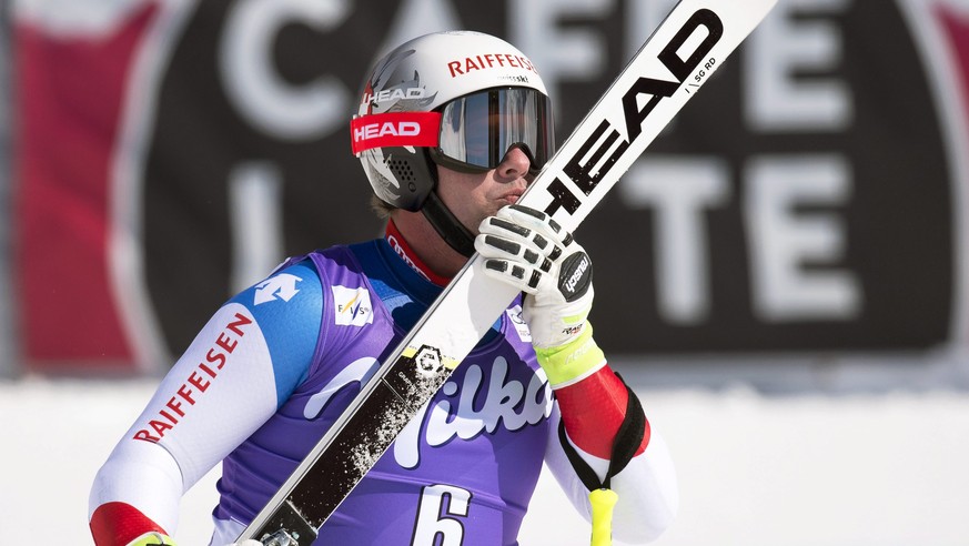 epa05215788 Beat Feuz of Switzerland reacts in the finish area during the men&#039;s Super G race at the FIS Alpine Skiing World Cup Finals in St. Moritz, Switzerland, 17 March 2016. EPA/JEAN-CHRISTOP ...