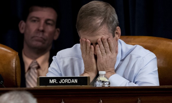 Rep. Jim Jordan, R-Ohio, puts his face in his hands during a public impeachment inquiry hearing of President Donald Trump with the House Judiciary Committee Monday, Dec. 9, 2019, on Capitol Hill in Wa ...