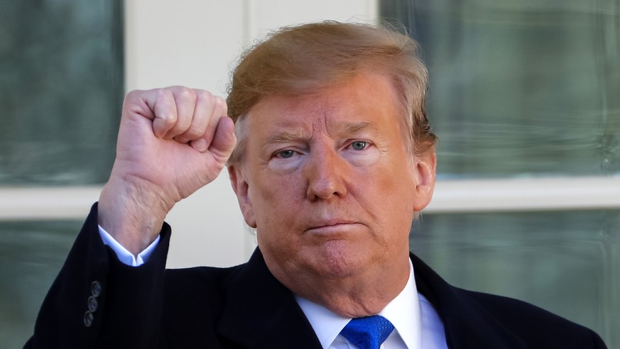 epa07373255 US President Donald J. Trump reacts as he leaves after speaking about a 328 billion USD (290.7 billion euro) spending bill to prevent another government shutdown at the Rose Garden of the  ...