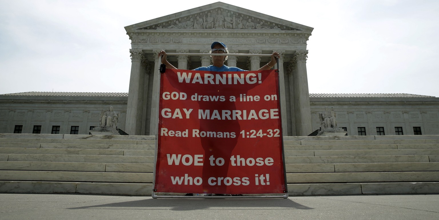Christine Weick protests against gay marriage in front of the U.S. Supreme Court in Washington June 8, 2015. A ruling on Obergefell v. Hodges, and whether the U.S. Constitution&#039;s guarantees of du ...