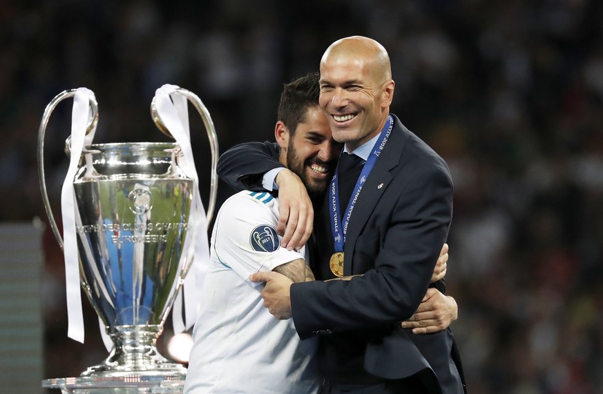 Real Madrid&#039;s Isco hugs coach Zinedine Zidane, right, after winning the Champions League Final soccer match between Real Madrid and Liverpool at the Olimpiyskiy Stadium in Kiev, Ukraine, Saturday ...