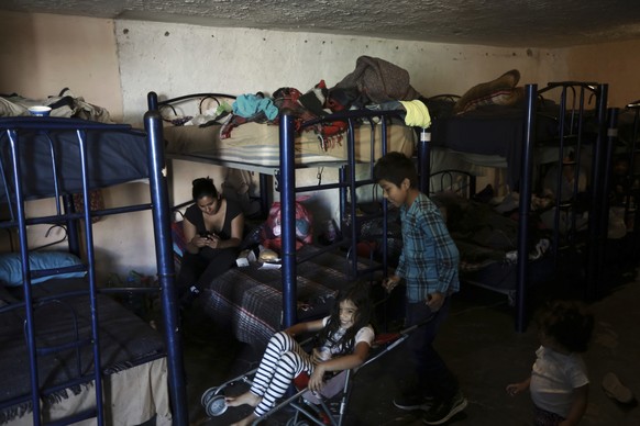 Migrant children pass the time in a shelter in Ciudad Juarez, Mexico, Tuesday, March 23, 2021. Mexico announced that U.S. advisers on border and immigration issues will meet with Mexican officials on  ...