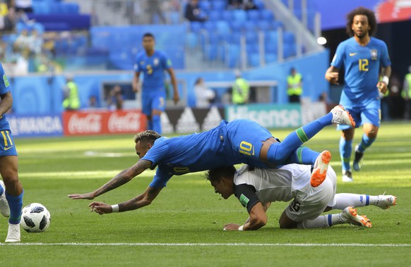 Brazil&#039;s Neymar falls in the tackle of Costa Rica&#039;s Cristian Gamboa during the group E match between Brazil and Costa Rica at the 2018 soccer World Cup in the St. Petersburg Stadium in St. P ...