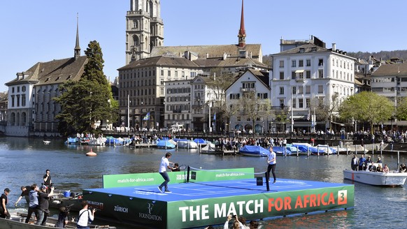Roger Federer, left, and Andy Murray, right, play tennis on the lake Zurich, in Zurich, Switzerland , Monday, April 10, 2017. &quot;The Match for Africa 3&quot;, the third charity tennis event for the ...