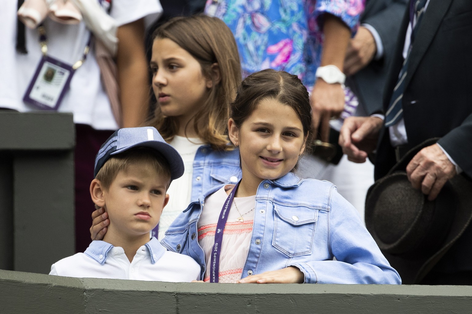 epa07690129 Roger Federer&#039;s children sit in the box during Federer&#039;s first round match against Lloyd Harris of South Africa, at the All England Lawn Tennis Championships in Wimbledon, London ...