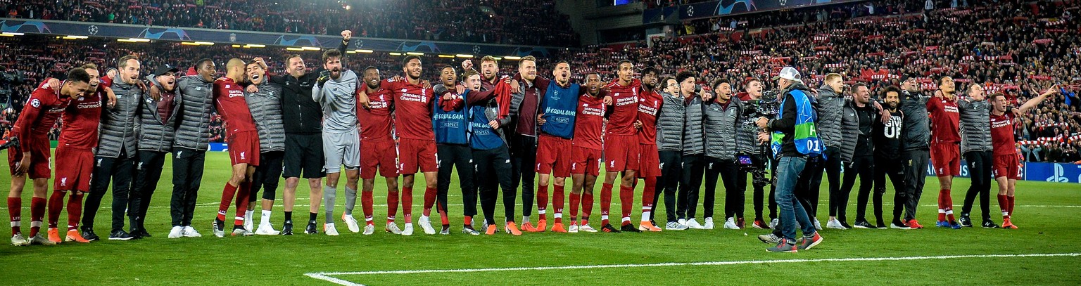 epa07554703 The team of Liverpool celebrates after winning the UEFA Champions League semi final second leg soccer match between Liverpool FC and FC Barcelona in Liverpool, Britain, 07 May 2019. Liverp ...
