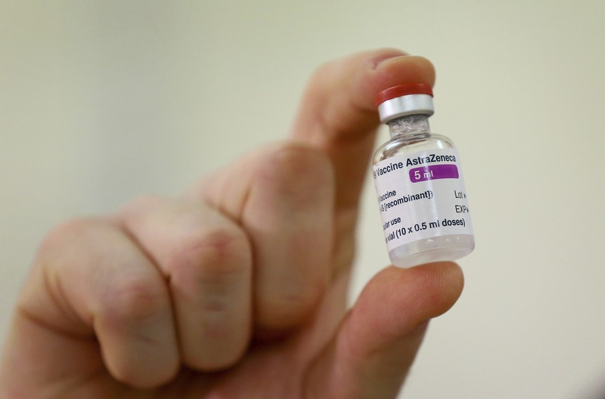FILE - In this Jan. 2, 2021 file photo a vial of the COVID-19 vaccine developed by Oxford University and U.K.-based drugmaker AstraZeneca is checked as they arrive at the Princess Royal Hospital in Ha ...