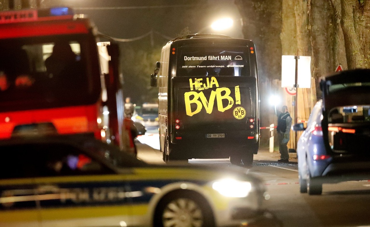 epa05903577 Team bus of Borussia Dortmund is seen on a street after it was hit by three explosions in Dortmund, Germany, 11 April 2017. According to reports, Borussia Dortmund&#039;s team bus was dama ...