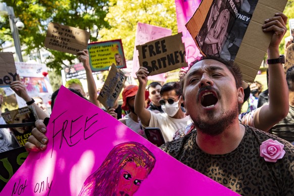epa09297677 Hundreds of demonstrators rally during a #FREEBRITNEY protest in front of the court house where Britney Spears addresses the court in conservatorship hearing in Los Angeles, California, US ...