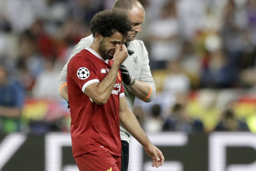 Liverpool&#039;s Mohamed Salah leaves after injuring himself during the Champions League Final soccer match between Real Madrid and Liverpool at the Olimpiyskiy Stadium in Kiev, Ukraine, Saturday, May ...