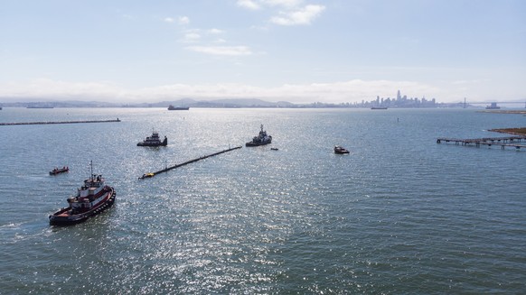 epa07004828 A handout photo made available by The Ocean Cleanup on 08 September 2018 shows the departure of a 120-meter tow test unit in Alameda, California, USA, 18 May 2018. Non-profit organization  ...