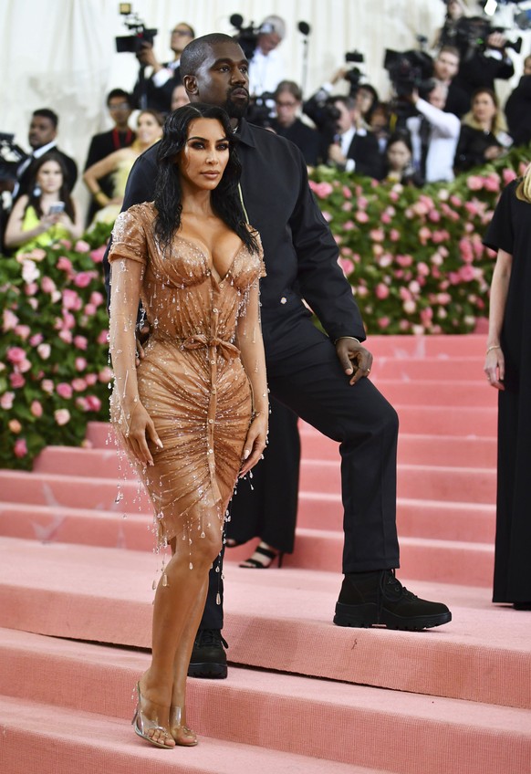 Kim Kardashian, left, and Kanye West attend The Metropolitan Museum of Art&#039;s Costume Institute benefit gala celebrating the opening of the &quot;Camp: Notes on Fashion&quot; exhibition on Monday, ...