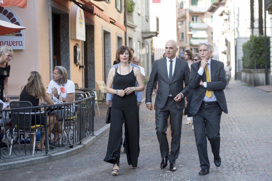 epa06121606 Swiss Federal Councillor Alain Berset (C), his wife Muriel (L) and the President of the Locarno Film Festival Marco Solari, (R) arrive for the official opening of the 70th Locarno Internat ...