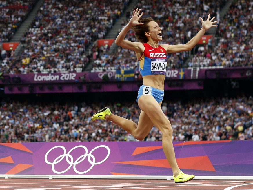 FILE - In this Aug. 11, 2012 file photo Russia&#039;s Mariya Savinova crosses the finish line to win gold in the women&#039;s 800-meter final during the athletics in the Olympic Stadium at the 2012 Su ...