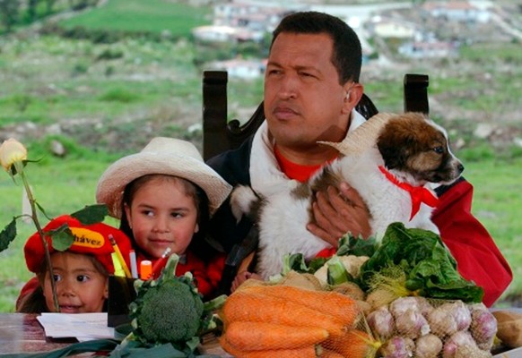 FILE - In this May 18, 2003 file photo released by Miraflores Press Office, Venezuela&#039;s President Hugo Chavez holds a mucuchies pup during his radio and television show &quot;Hello President&quot ...