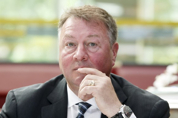 Michael &quot;Mike&quot; Gillis, new member of the board of directors of Geneve-Servette HC, listens a speech about the new management of Geneve-Servette HC, during a press conference, in Geneva, Swit ...