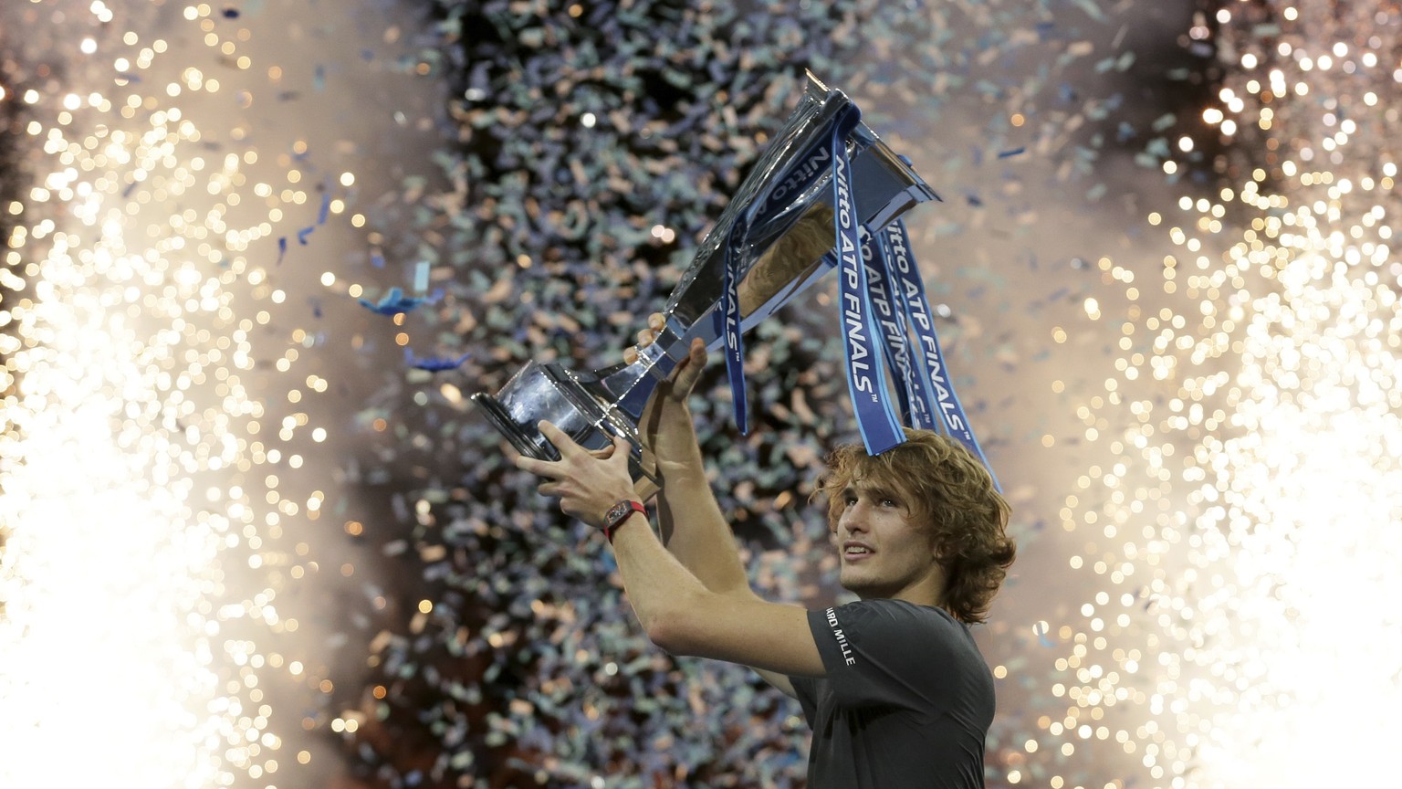 FILE - In this Sunday Nov. 18, 2018 file photo, Alexander Zverev of Germany holds up the trophy after defeating Novak Djokovic of Serbia in their ATP World Tour Finals singles final tennis match at th ...