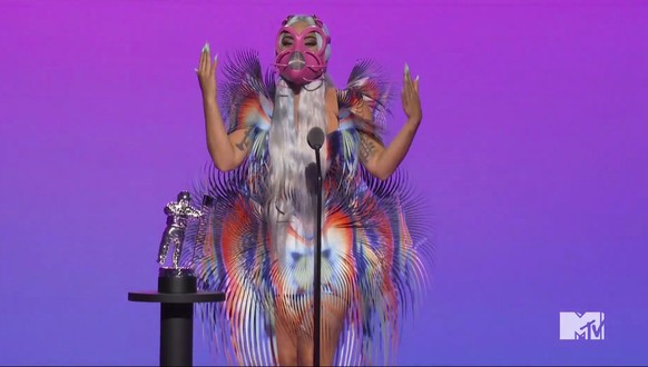 In this video grab issued Sunday, Aug. 30, 2020, by MTV, Lady Gaga accepts the award for best collaboration for &quot;Rain on Me&quot; during the MTV Video Music Awards. (MTV via AP)