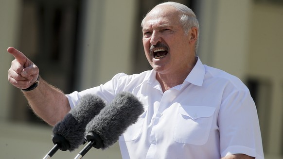 Belarusian President Alexander Lukashenko addresses his supporters gathered at Independent Square of Minsk, Belarus, Sunday, Aug. 16, 2020. Thousands of people have gathered in a square near Belarus&# ...