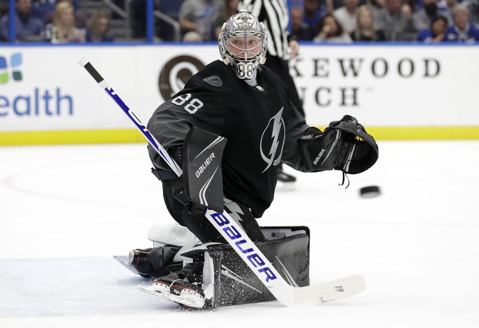 Tampa Bay Lightning goaltender Andrei Vasilevskiy makes a stick save on a shot by the St. Louis Blues during the first period of an NHL hockey game Thursday, Feb. 7, 2019, in Tampa, Fla. (AP Photo/Chr ...