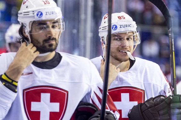 Switzerland&#039;s Andres Ambuehl, left, and Switzerland`s Sven Andrighetto during the semi final game between Canada and Switzerland, at the IIHF 2019 World Ice Hockey Championships, at the Steel Are ...