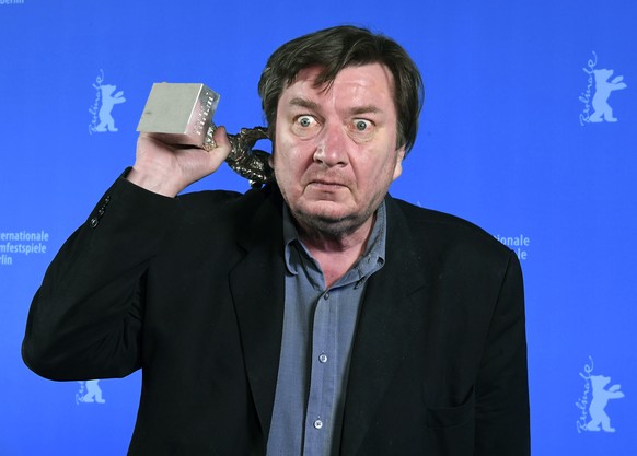 Finnish director Aki Kaurismaki poses for photographers after receiving the Silver Bear for Best Director for &#039;The Other Side of Hope&#039; at the awards ceremony of the 67th Berlinale Film Festi ...