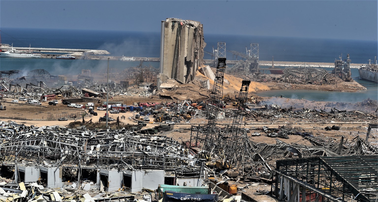 epa08585091 A general view of the destroyed port in the aftermath of a massive explosion in downtown Beirut, Lebanon, 05 August 2020. According to media reports, at least 100 people were killed and mo ...