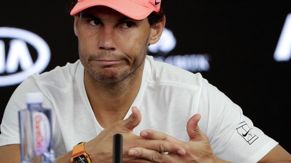 Spain&#039;s Rafael Nadal answers questions at a press conference after retiring injured from his quarterfinal against Croatia&#039;s Marin Cilic at the Australian Open tennis championships in Melbour ...