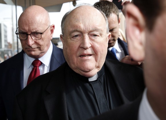 epa06859884 Archbishop Philip Wilson leaves after sentencing at Newcastle Local Court in Newcastle, Australia, 03 July 2018. The Adelaide Archbishop has been found guilty of concealing historical chil ...