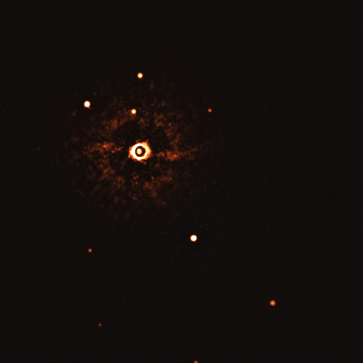 epa08560401 An undated handout photo made available by the European Southern Observatory (ESO) shows star TYC 8998-760-1 accompanied by two giant exoplanets, TYC 8998-760-1b and TYC 8998-760-1c in the ...