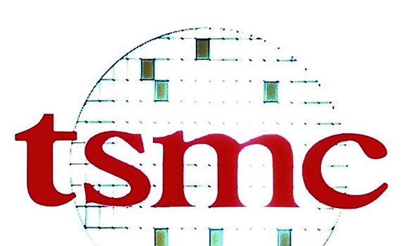 FILE - In this Oct. 27, 2005, file photo the logo of Taiwan Semiconductor Manufacturing Co. (TSMC) is displayed during a third quarter press conference in Taipei, Taiwan. TSMC, the biggest contract ma ...