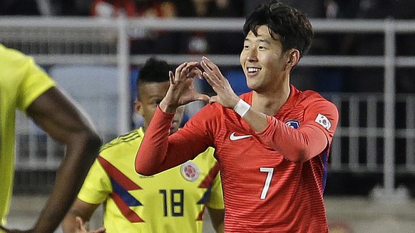 South Korea&#039; Son Heung-min, right, celebrates after scoring a goal against Colombia during a friendly soccer match at Suwon World Cup Stadium in Suwon, South Korea, Friday, Nov. 10, 2017. (AP Pho ...