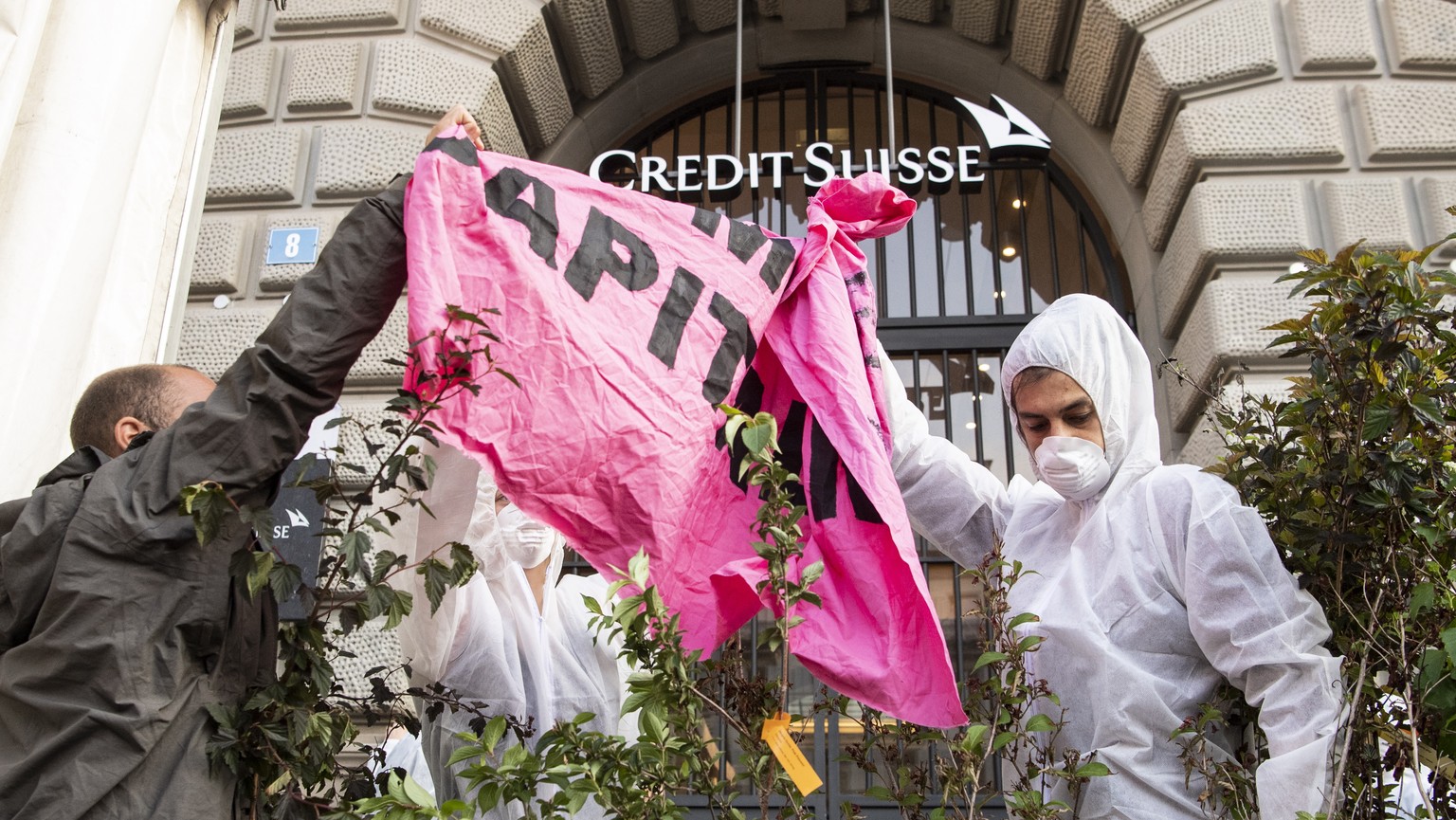 epa07702720 A group of climate activists from the Collective Climate Justice organization is blocking the entrance to the Swiss bank Credit Suisse at Paradeplatz in Zurich, Switzerland, 08 July 2019.  ...