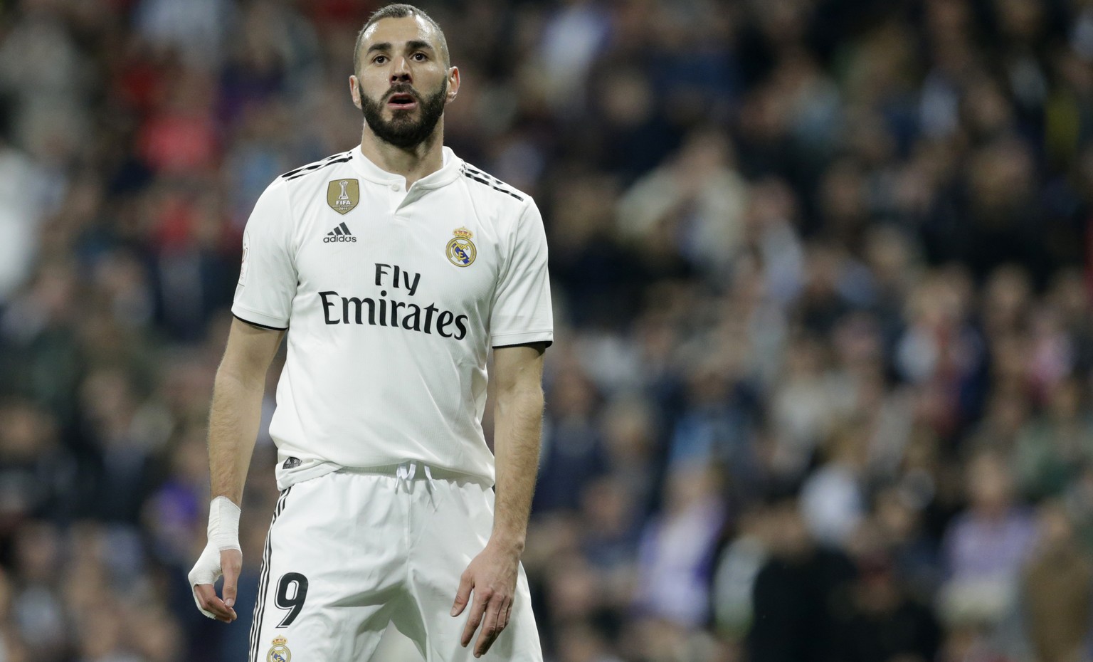 Real forward Karim Benzema reacts after missing a scoring chance during the Copa del Rey semifinal second leg soccer match between Real Madrid and FC Barcelona at the Bernabeu stadium in Madrid, Spain ...
