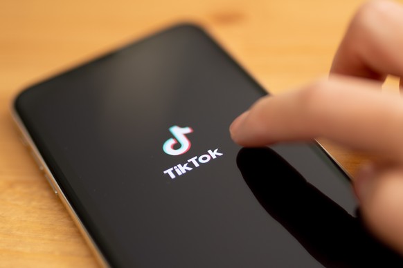 epa08667462 (FILE) - A close-up shows the video-sharing application TikTok on a smart phone in Berlin, Germany, 07 July 2020 (reissued 14 September 2020). According to statement issued by Microsoft, C ...