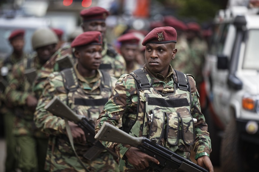 Kenyan security forces walk from the scene as continued blasts and gunfire could be heard early Wednesday, Jan. 16, 2019, in Nairobi, Kenya. Extremists stormed a luxury hotel in Kenya&#039;s capital o ...