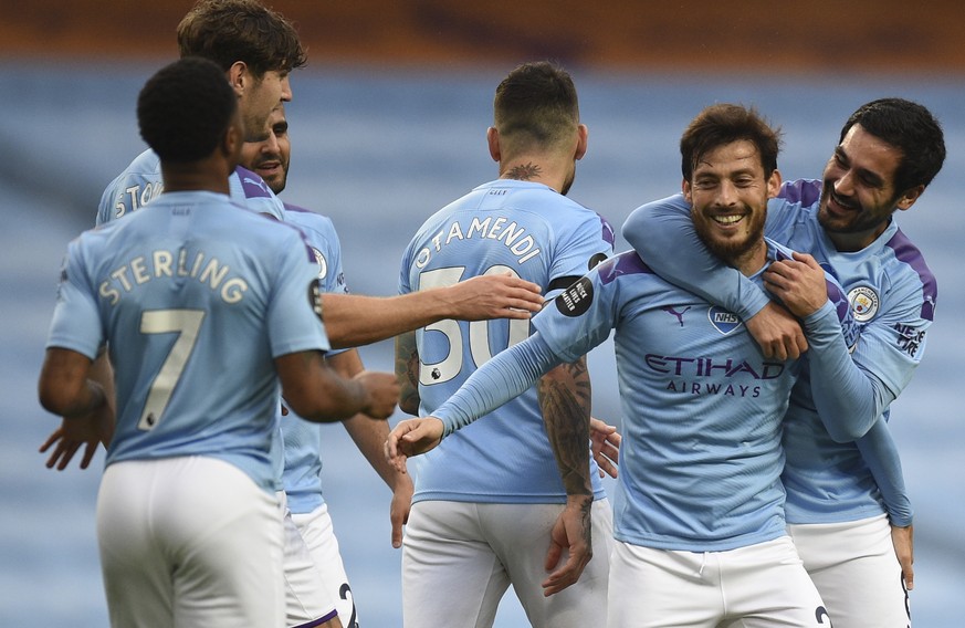 epa08535052 David Silva (2-R) of Manchester City celebrates with teammates after scoring the 4-0 lead during the English Premier League soccer match between Manchester City and Newcastle United in Man ...