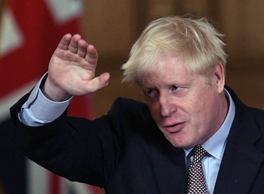 Britain&#039;s Prime Minister Boris Johnson reacts during a virtual press conference at Downing Street in London, Wednesday Sept. 9, 2020, following the announcement that the legal limit on social gat ...
