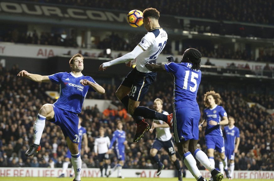 Tottenham&#039;s Dele Alli, centre, scores a goal during the English Premier League soccer match between Tottenham Hotspur and Chelsea at White Hart Lane stadium in London, Wednesday, Jan. 4, 2017. (A ...