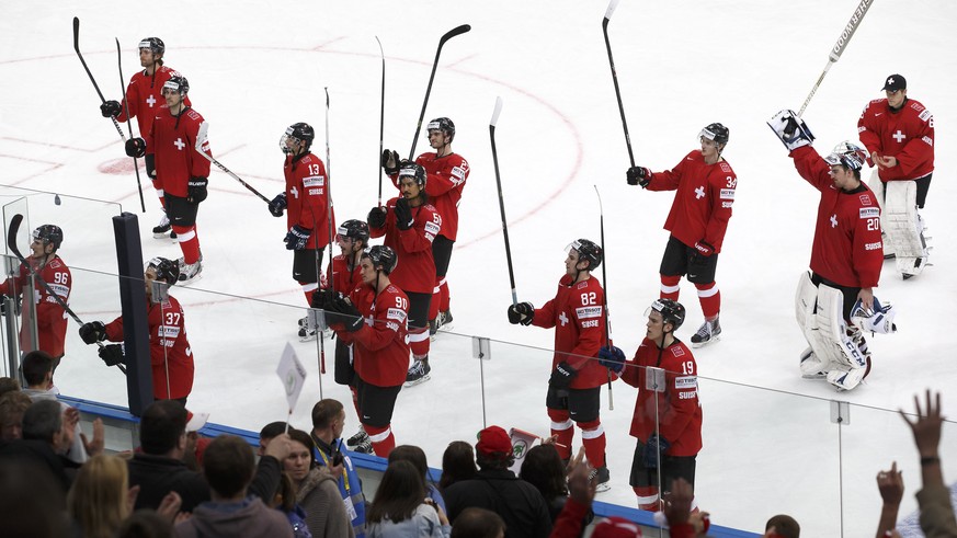 Switzerland&#039;s players cheer with their supporters after beating Germany during the 2014 IIHF Ice Hockey World Championships preliminary round game Switzerland vs Germany, at the Minsk Arena, in M ...
