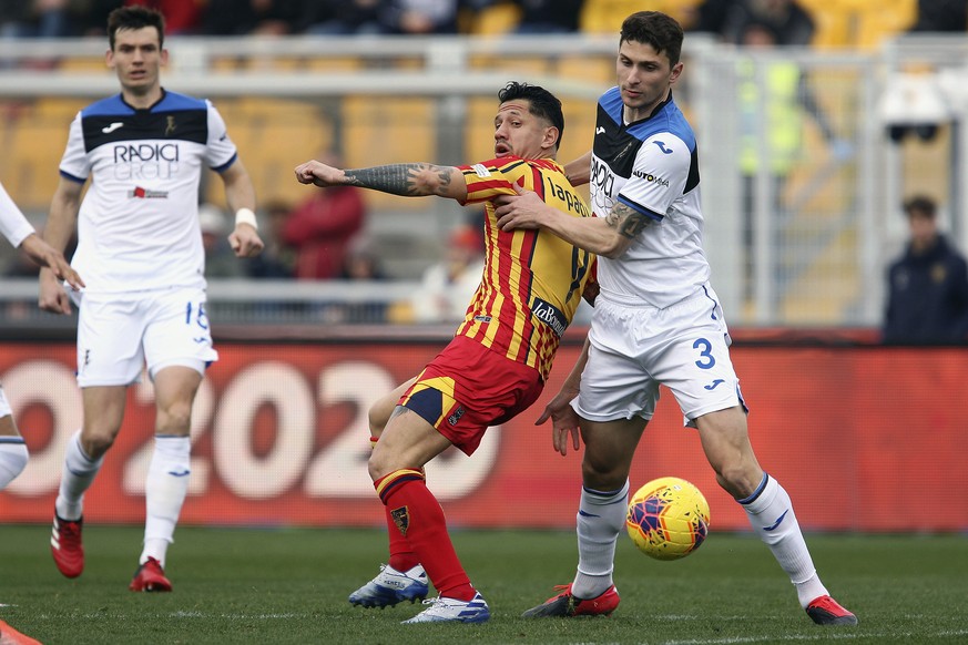 Atalanta&#039;s Mattia Caldara, right, vies for the ball with Lecce&#039;s Gianluca Lapadula during a Serie A soccer match between Lecce and Atalanta, in Lecce&#039;s Via del Mare stadium, southern It ...