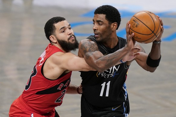 Toronto Raptors&#039; Fred VanVleet (23) defends against Brooklyn Nets&#039; Kyrie Irving (11) during the first half of an NBA basketball game Friday, Feb. 5, 2021, in New York. (AP Photo/Frank Frankl ...