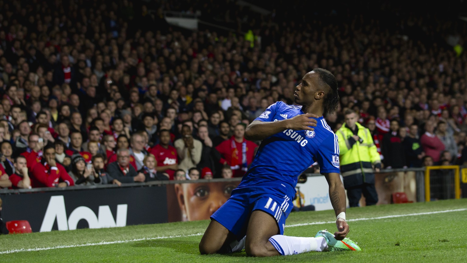 Chelsea&#039;s Didier Drogba celebrates after scoring against Manchester United during the English Premier League soccer match between Manchester United and Chelsea at Old Trafford Stadium, Manchester ...