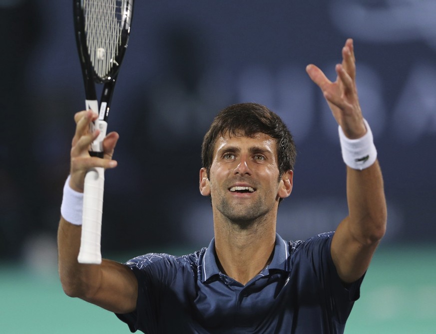 Serbia&#039;s Novak Djokovic celebrates after he defeated South Africa&#039;s Kevin Anderson in the final match of the Mubadala World Tennis Championship in Abu Dhabi, United Arab Emirates, Saturday,  ...