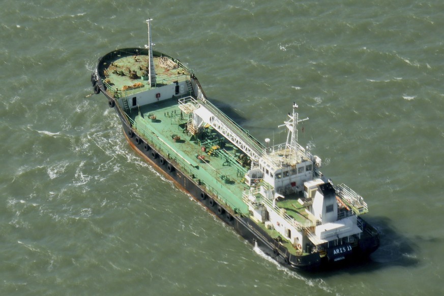 In this photo taken Monday, Oct. 27, 2014, the Aris 13 oil tanker is seen from a helicopter in the harbor of Gladstone, Australia. Pirates have hijacked the Aris 13 oil tanker off the coast of Somalia ...