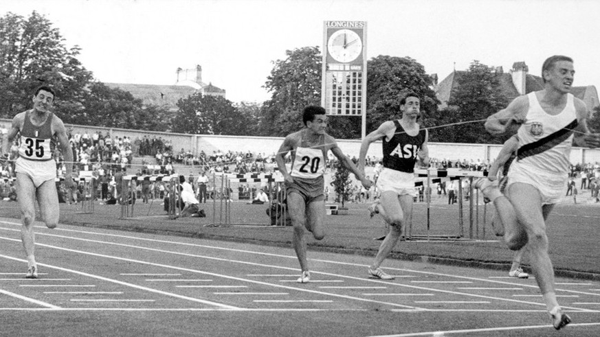 German sprinter Armin Hary, rightmost, achieves the finish line by a clear margin at the Letzigrund Stadium in Zurich, Switzerland, on June 21, 1960. As the first race was annulled, the 23-year-old sp ...
