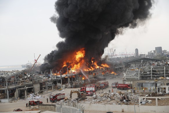 Fire burns in the port in Beirut, Lebanon, Thursday, Sept. 10. 2020. (AP Photo/Hussein Malla)